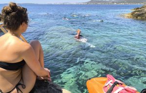 a group of people swimming in the water